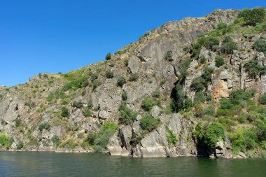 Arribes del Duero (Douro gorges) cliffs since touristic ship. clipart