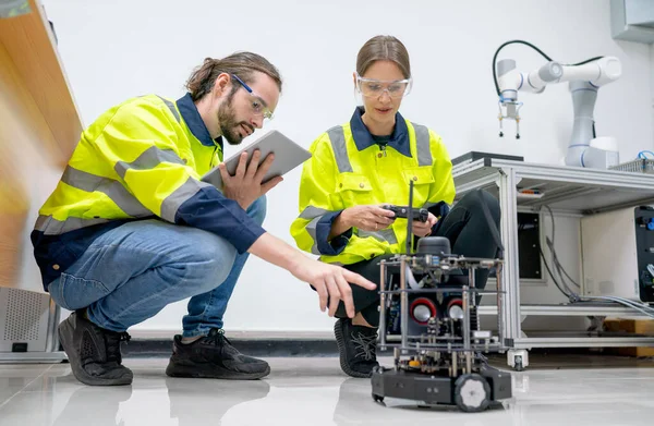 Two Caucasian Professional Technician Engineer Workers Sit Floor Help Check — Stock Photo, Image