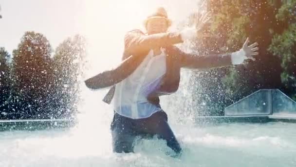 Young Man Water Having Fun Fountain — Stock Video