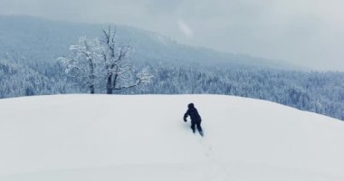 Lost hiker walking outdoors in snow storm