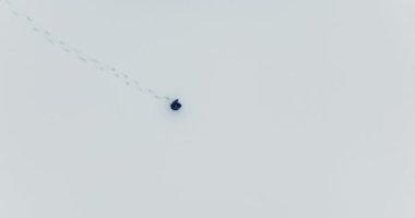 Lost hiker walking outdoors in snow storm