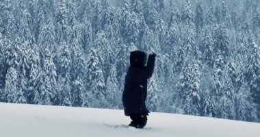 Lost hiker walking outdoors in snow storm