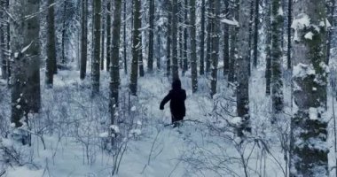 Lost hiker walking outdoors in snow storm