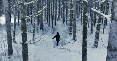 Lost hiker walking outdoors in snow storm