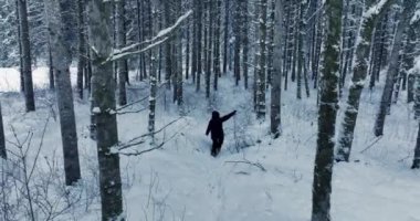 Lost hiker walking outdoors in snow storm