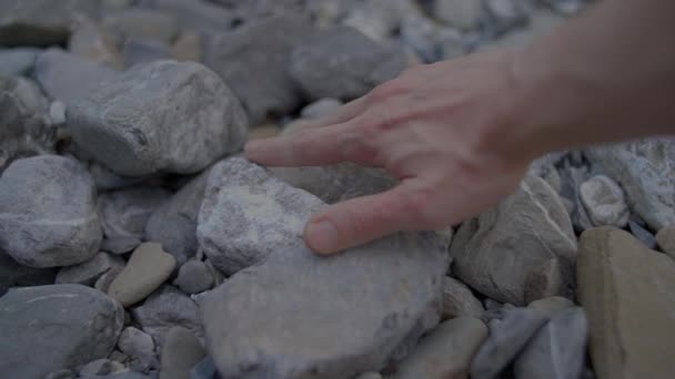Person Touching Feeling Stones Rocks Outdoors Riverbed High Quality Footage — Stock Video