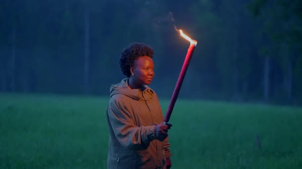 Fearless Female Person Holding Flaming Burning Torchlight Walking Outdoors Inglés — Vídeos de Stock