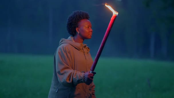 Fearless Female Person Holding Flaming Burning Torchlight Walking Outdoors Inglés — Vídeos de Stock