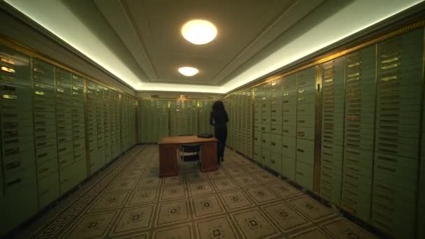 Woman Standing Dimly Lit Hallway Building Surrounded Lockers Wooden Flooring — Stock Video