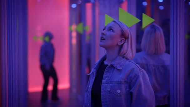 Young Blond Woman Exploring Room Mirrors Dreamlike Fantasy Neon Light — Stockvideo