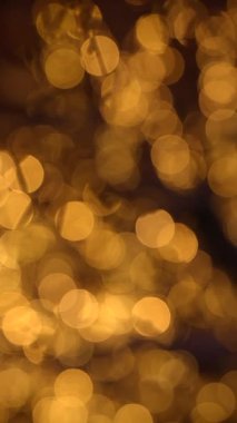 Sıcak bokeh ışıkları, soyut fotoğrafçılık ve tasarım çalışmaları için ideal, büyüleyici bir atmosfer yaratır.