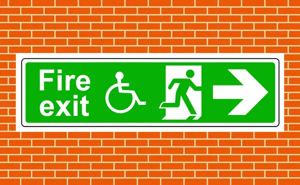 stock image Fire exit wheelchair access right keep clear of obstructions sign