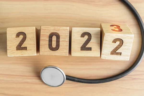 stock image 2023 Happy New Year for health care, Insurance, Wellness and medical concept. Stethoscope of doctor on table