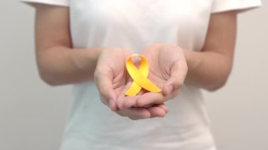 Yellow September, Suicide prevention day, Childhood, Sarcoma, bone and bladder cancer Awareness month, Yellow Ribbon for supporting people life and illness. Healthcare and World cancer day concept