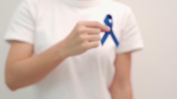 March Colorectal Cancer Awareness Month Woman Holding Dark Blue Ribbon — Stock video