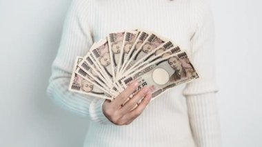 hand counting Japanese Yen banknote. Thousand Yen money. Japan cash, Tax, Recession Economy, Inflation, Investment, finance, savings, salary and payment concepts