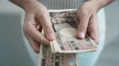 hand counting Japanese Yen banknote. Thousand Yen money. Japan cash, Tax, Recession Economy, Inflation, Investment, finance, savings, salary and payment concepts