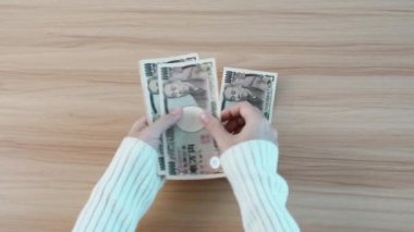 hand counting Japanese Yen banknote. Thousand Yen money. Japan cash, Tax, Recession Economy, Inflation, Investment, finance, savings, salary and payment concepts