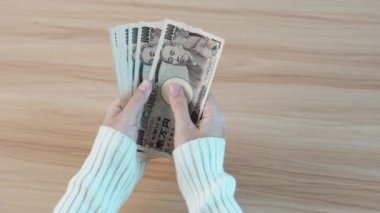 hand counting Japanese Yen banknote. Thousand Yen money. Japan cash, Tax, Recession Economy, Inflation, Investment, finance, savings, salary and payment concepts