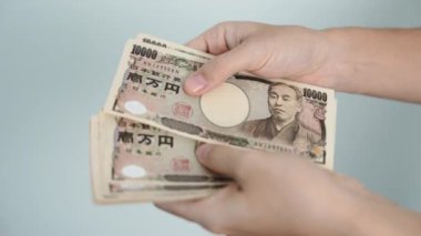 hand counting Japanese Yen banknote. Thousand Yen money. Japan cash, Tax, Recession Economy, Inflation, Investment, finance, savings, salary and payment concepts