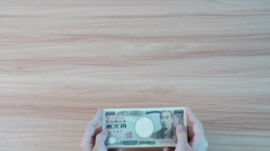 hand counting Japanese Yen banknote. Thousand Yen money. Japan cash, Tax, Recession Economy, Inflation, Investment, finance, savings, salary and payment concepts
