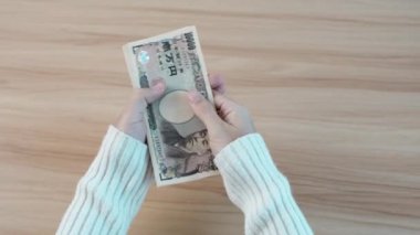 hand counting Japanese Yen banknote. Thousand Yen money. Japan cash, Tax, Recession Economy, Inflation, Investment, finance, savings, salary and payment concepts