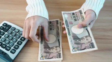 hand counting Japanese Yen banknote. Thousand Yen money. Japan cash, Tax, Recession Economy, Inflation, Investment, finance, savings, salary and payment concepts