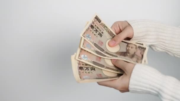 手計算日本円の銀行券 千円のお金 日本の現金 景気後退 インフレ 支払の概念 — ストック動画
