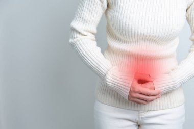 Woman having Stomach pain. Ovarian and Cervical cancer, Cervix disorder, Endometriosis, Hysterectomy, Uterine fibroids, Reproductive system, menstruation, diarrhea and Pregnancy concept