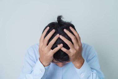 man having headache. stressed, Migraine, World Brain Tumor day, Brain Stroke, Dementia, alzheimer, parkinson and world mental health concept