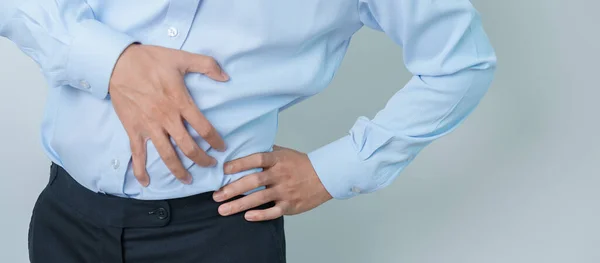 man having back pain. Urinary system and Stones, Cancer, world kidney day, Chronic kidney stomach, liver pain and pancreas concept