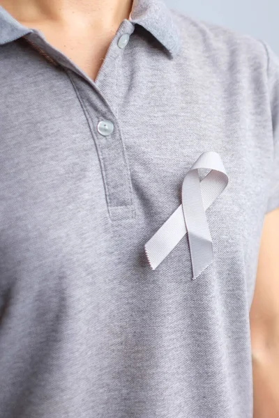 Brain Cancer Awareness month, grey color Ribbon for supporting people life. Healthcare and World cancer day concept