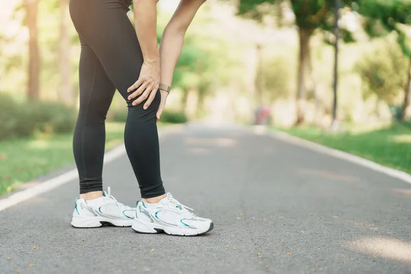 adult woman with muscle pain during running. runner have knee ache due to Runners Knee or Patellofemoral Pain Syndrome, osteoarthritis and Patellar Tendinitis. Sports injuries and medical concept
