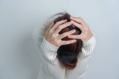 Woman having headache. stressed, Migraine, World Brain Tumor day, Brain Stroke, Dementia, alzheimer, parkinson and world mental health concept