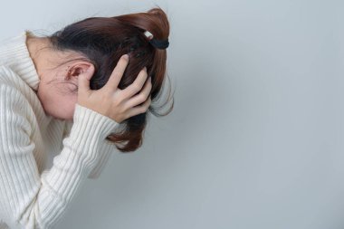 Woman having headache. stressed, Migraine, World Brain Tumor day, Brain Stroke, Dementia, alzheimer, parkinson and world mental health concept