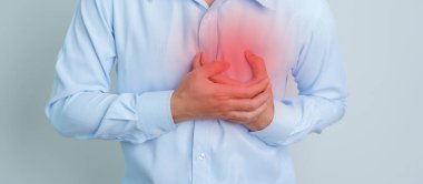 man hand holding chest ache. Heart disease, angina disease and symptom heart attack disease Cardiovascular, Atherosclerosis, Hypertensive world Heart day and health concept