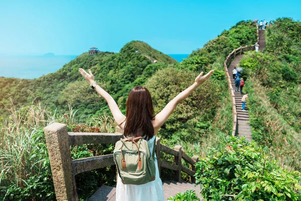 stock image woman traveler visiting in Taiwan, Tourist with backpack sightseeing in Bitou Cape Hiking Trail, New Taipei City. landmark and popular attractions near Taipei. Asia Travel concept