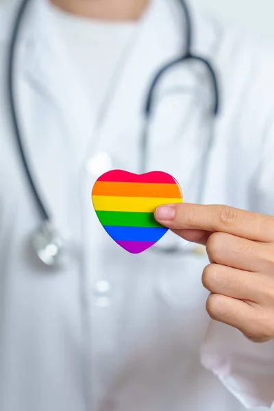 LGBT pride month or LGBTQ+ or LGBTQIA+ and health concept. Doctor with rainbow and colorful heart shape with for Lesbian, Gay, Bisexual, Transgender, Queer and Pansexual community