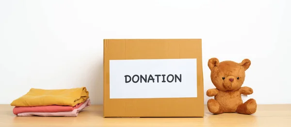 Concepto Donación Caridad Voluntariado Donación Entrega Niños Muñeca Oso Ropa — Foto de Stock