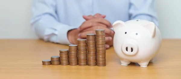 Money Saving for Future Plan, Retirement fund, Pension, Investment, Wealth Business and Financial concepts. coin stack with piggy bank on table, Money Counting and stack arrangement for deposit