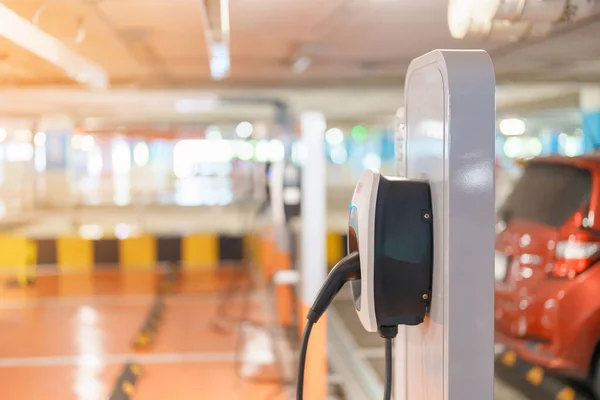 stock image EV charger station for Electric car charging battery at station. green energy power, Eco friendly alternative, technology and environment concepts