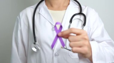 purple Ribbon for Violence, Pancreatic, Esophageal, Testicular cancer, Alzheimer, epilepsy, lupus, Sarcoidosis and Fibromyalgia. Awareness month and World cancer day concept