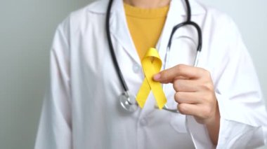 Yellow September, Suicide prevention day, Childhood, Sarcoma, bone and bladder cancer Awareness month, Yellow Ribbon for supporting people life and illness. Healthcare and World cancer day concept