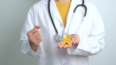 Yellow September, Suicide prevention day, Childhood, Sarcoma, bone and bladder cancer Awareness month, Yellow Ribbon for supporting people life and illness. Healthcare and World cancer day concept