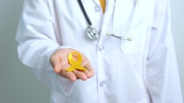 Yellow September, Suicide prevention day, Childhood, Sarcoma, bone and bladder cancer Awareness month, Yellow Ribbon for supporting people life and illness. Healthcare and World cancer day concept