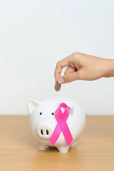 October Breast Cancer Awareness month, Pink Ribbon with Piggy Bank for support illness life. Health, Donation, Charity, Campaign, Money Saving, Fund, women day and World cancer day concept