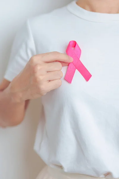 Pink October Breast Cancer Awareness month, woman with pink Ribbon in hospital for support people life and illness. National cancer survivors month, Mother and World cancer day concept