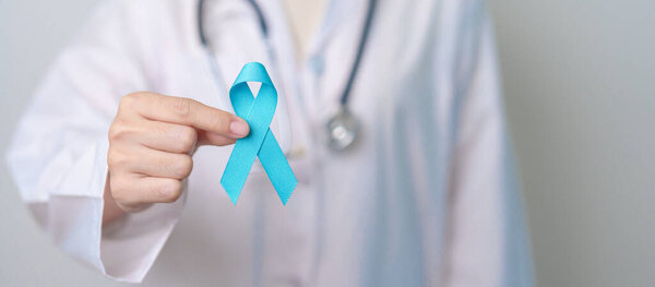 Blue November Prostate Cancer Awareness month, Doctor with Blue Ribbon in hospital for support people life and illness. Healthcare, International men, Father, Diabetes and World cancer day