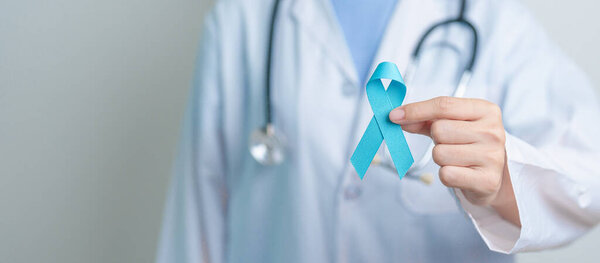 Blue November Prostate Cancer Awareness month, Doctor with Blue Ribbon in hospital for support people life and illness. Healthcare, International men, Father, Diabetes and World cancer day