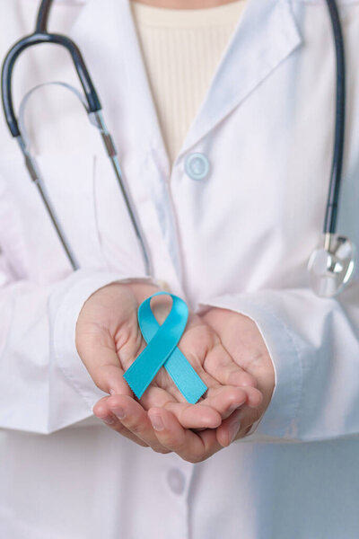 Blue November Prostate Cancer Awareness month, Doctor with Blue Ribbon in hospital for support people life and illness. Healthcare, International men, Father, Diabetes and World cancer day